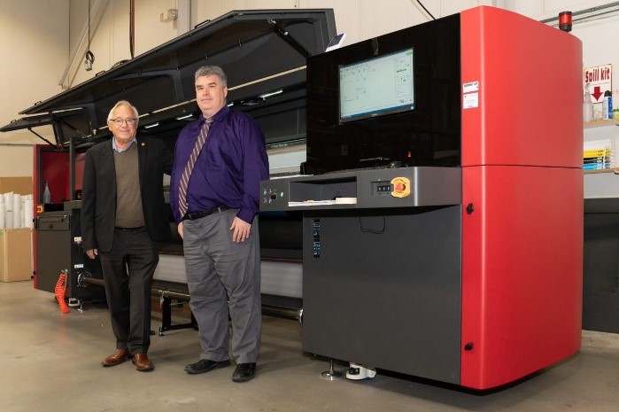 image of President and VP of Intergraphics Decal Ltd in front of  EFI Pro 32r Plus
